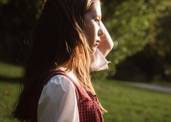 Young woman in traditional clothing outdoors