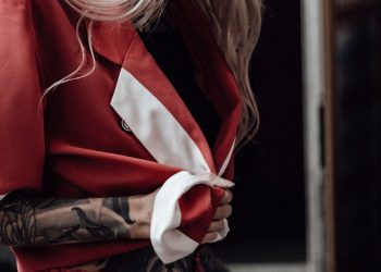 woman in red and white long sleeve shirt