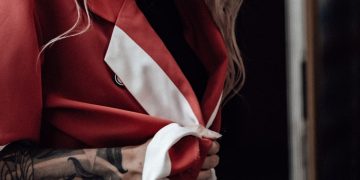 woman in red and white long sleeve shirt